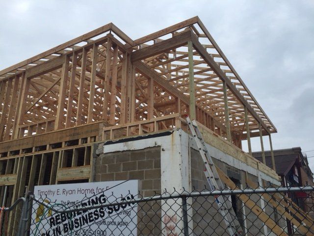 A building under construction with a sign