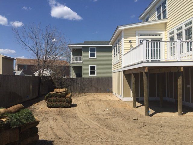 The backyard of a house with a large deck