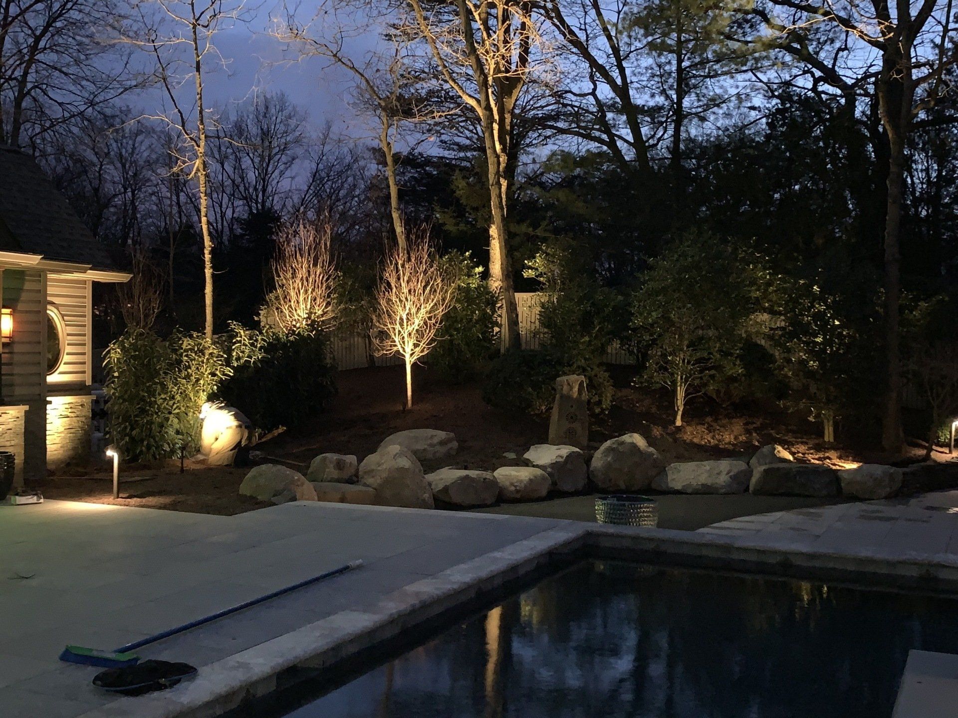 A swimming pool with trees in the background