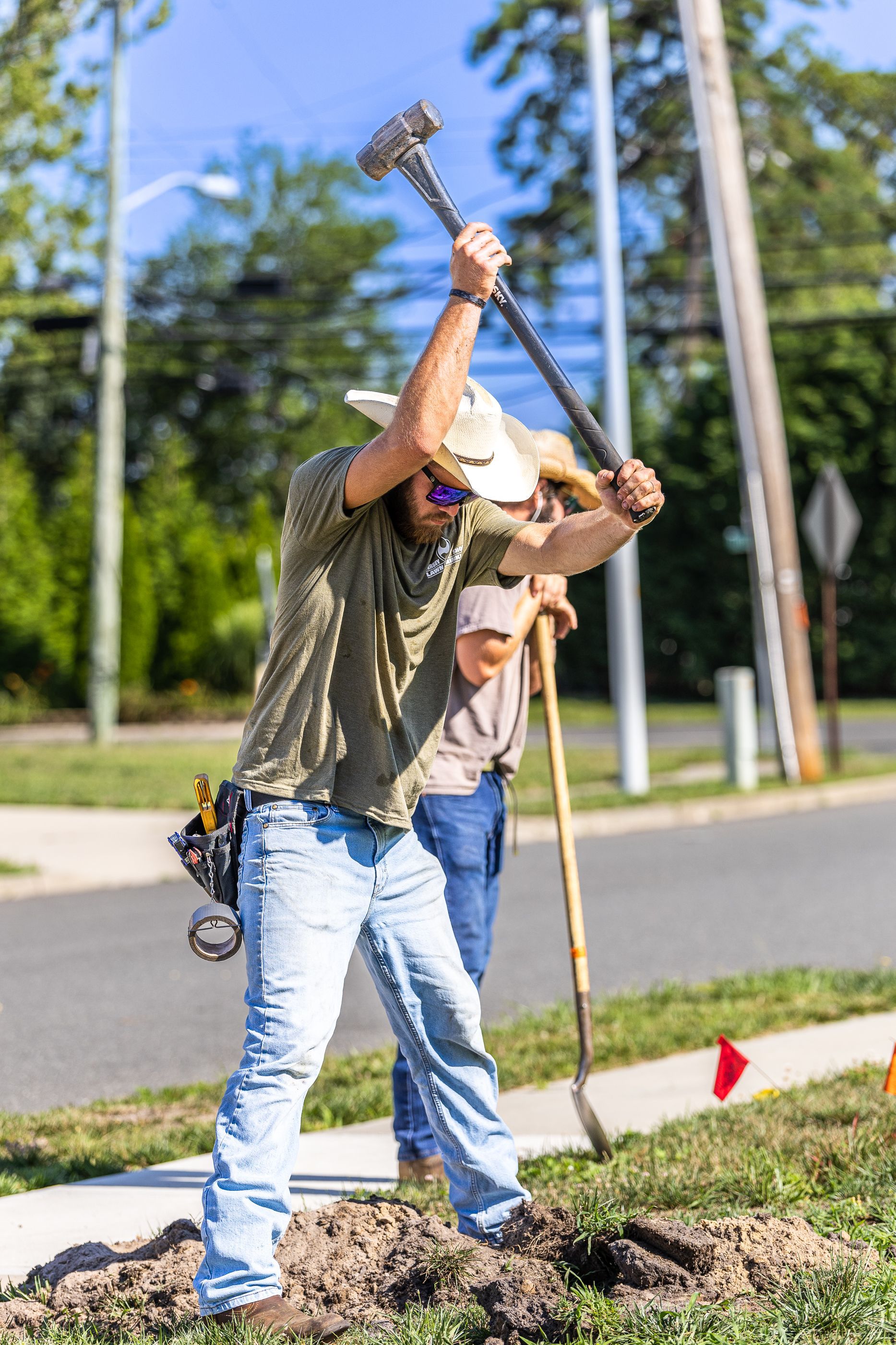A man is digging a hole in the ground