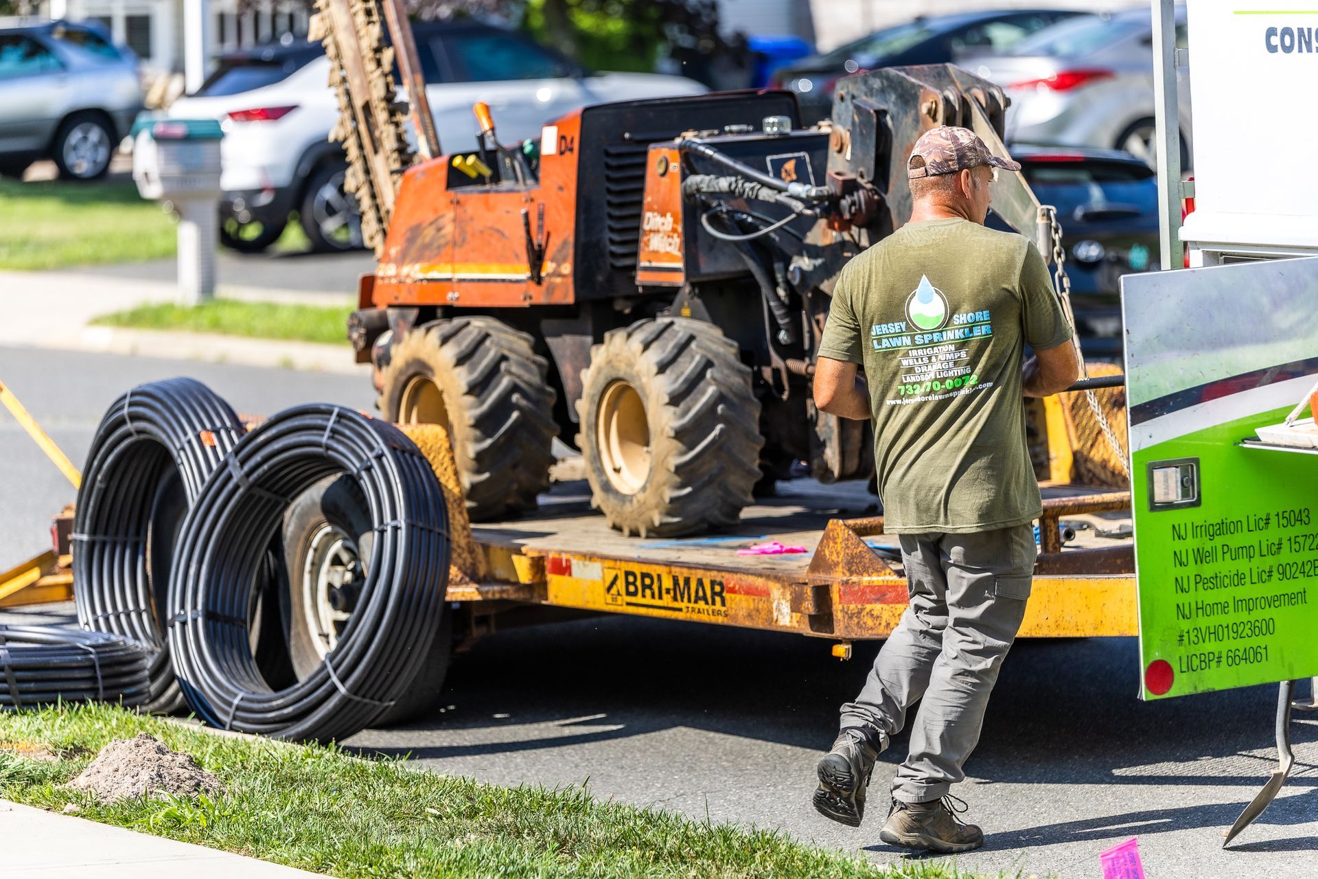 A man on a tractor pulling a trailer