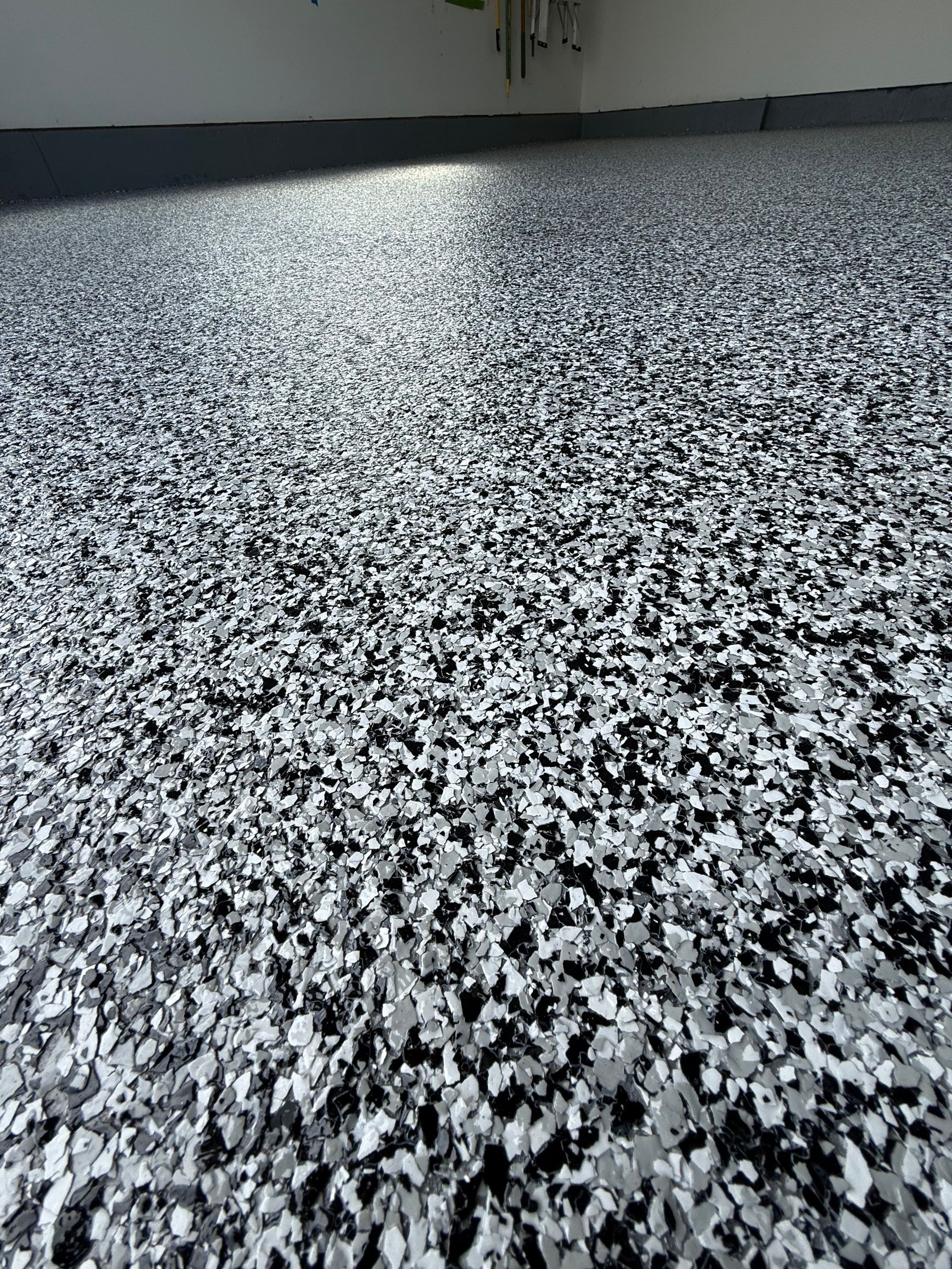 Black-and-white speckled gravel surface stretching into the distance outdoors