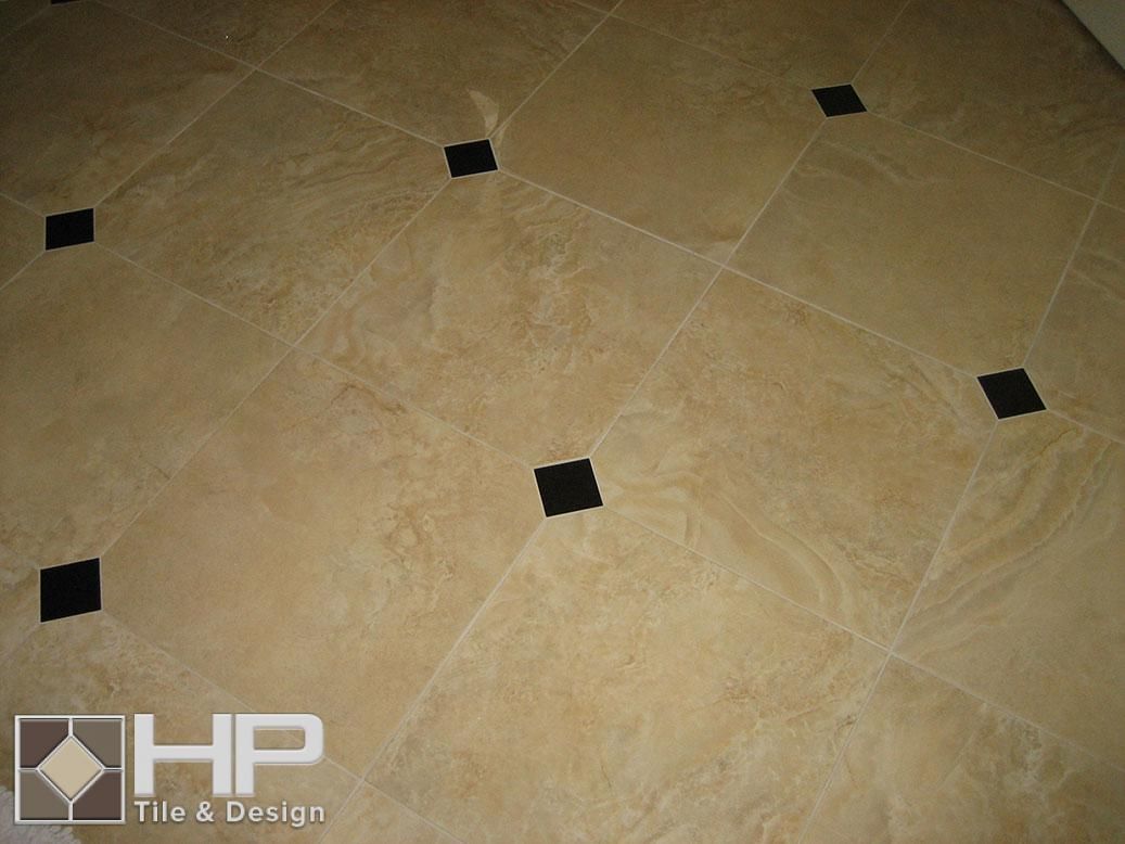 Beige tile floor with black square inlays