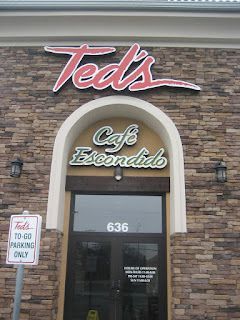 Ted's Cafe Escondido restaurant exterior with stone facade and sign 