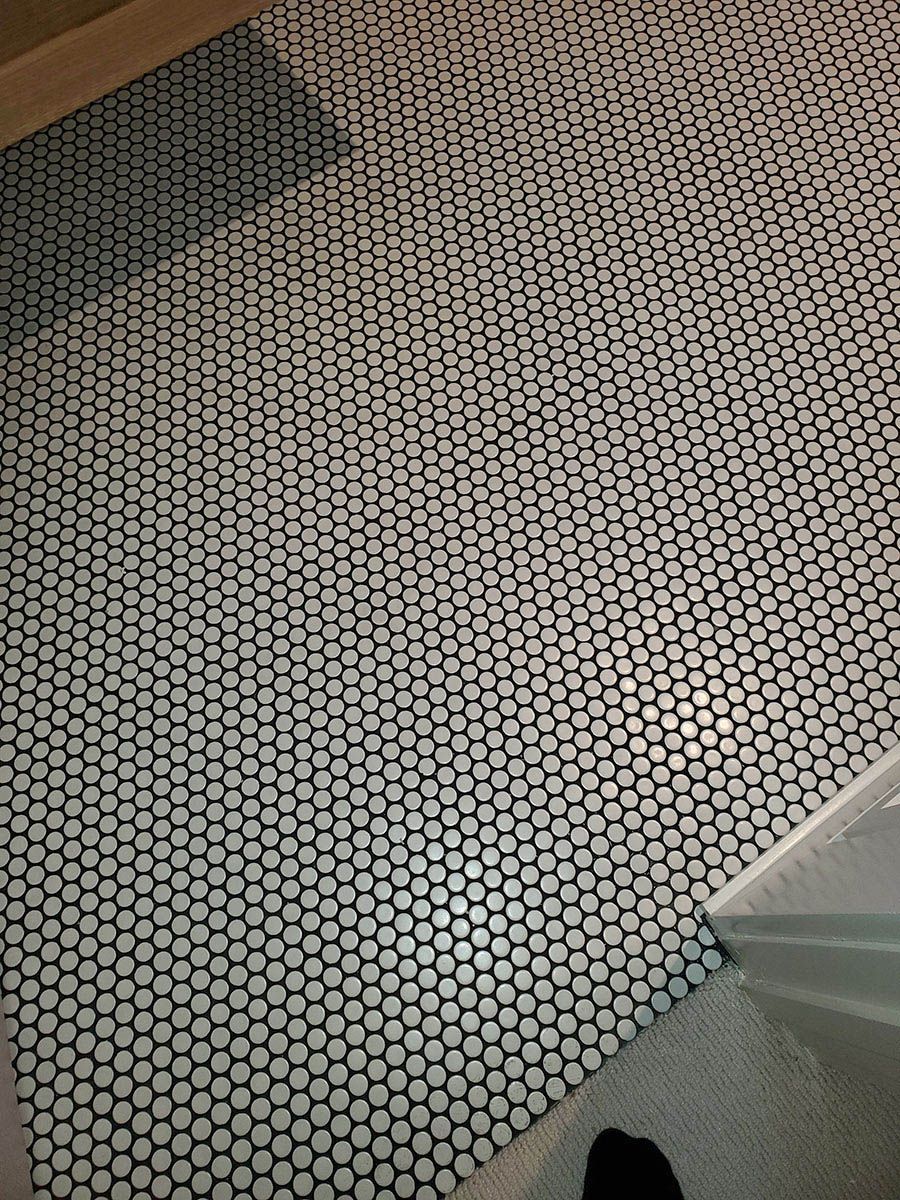 Black and white hexagon tile floor in a bathroom
