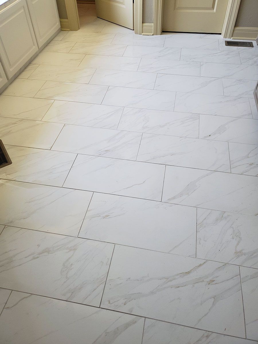 White tiled kitchen floor, newly installed