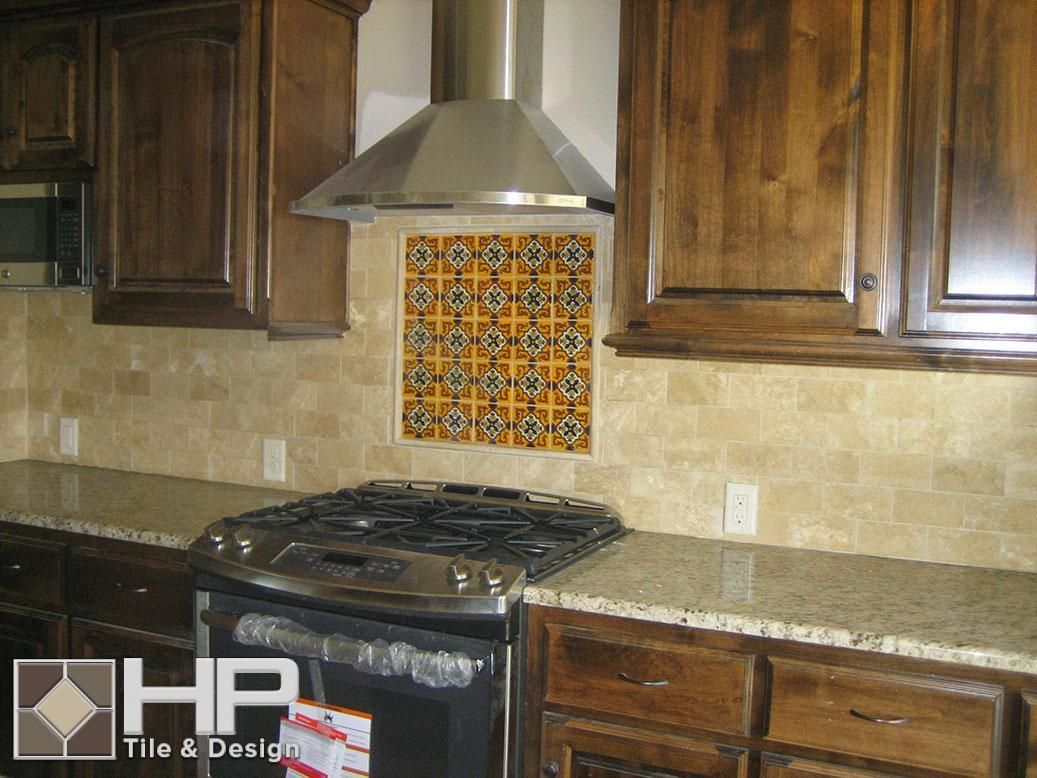 Kitchen with dark wood cabinets, gas range, beige countertops, and decorative tile backsplash.
