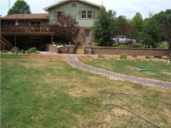 A house with a brick walkway in front of it