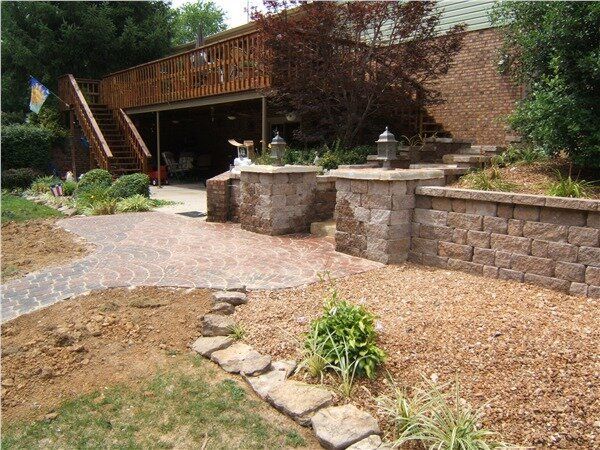 Back yard with mulch and decorative stone walkway