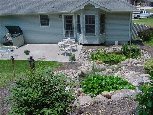 Landscaped back yard with decorative stone