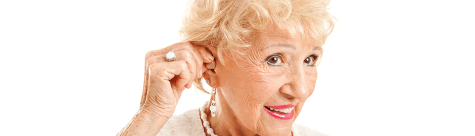 Old Pretty lady putting a hearing aid device