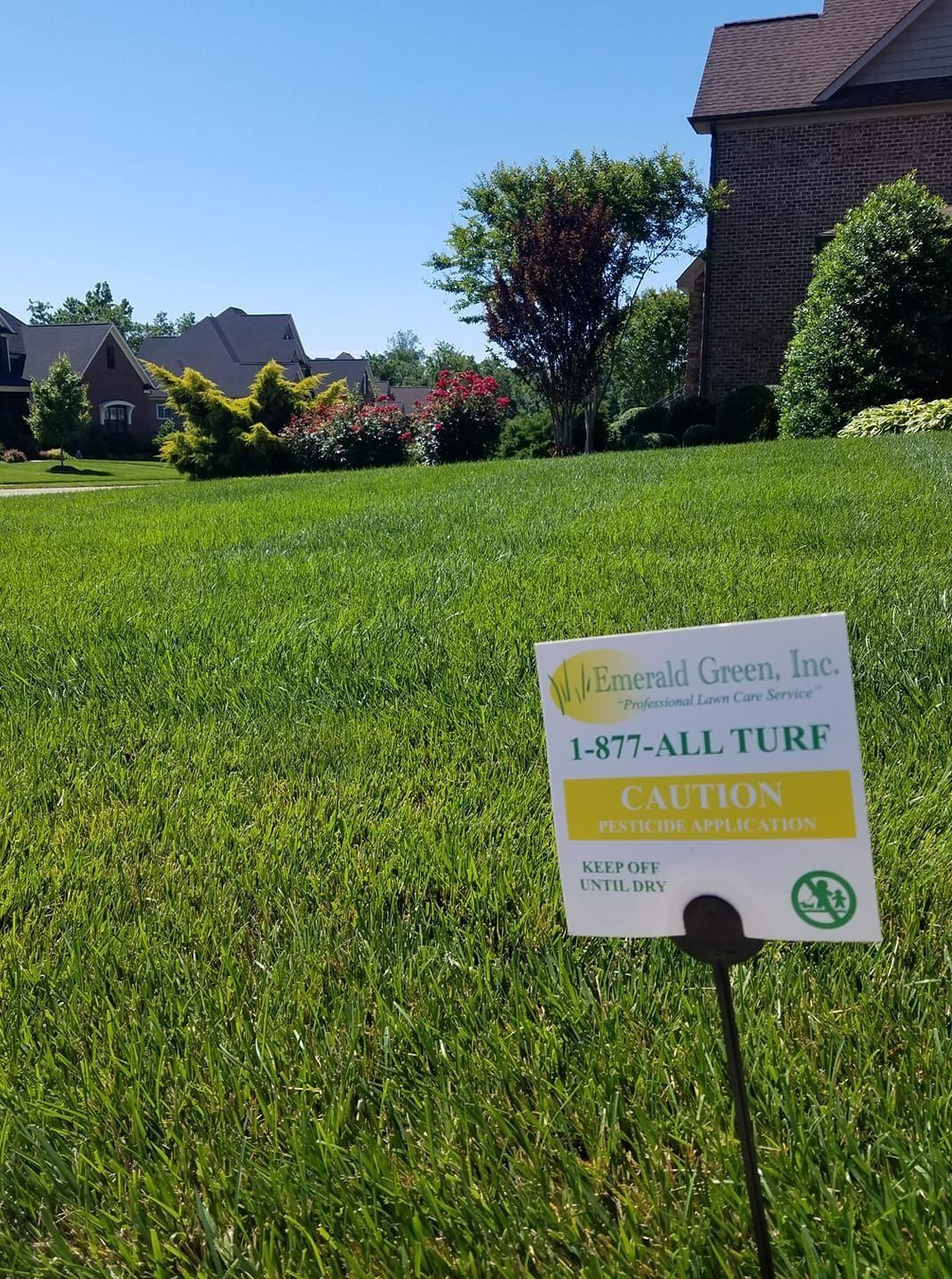 Sign on a green lawn with text: 