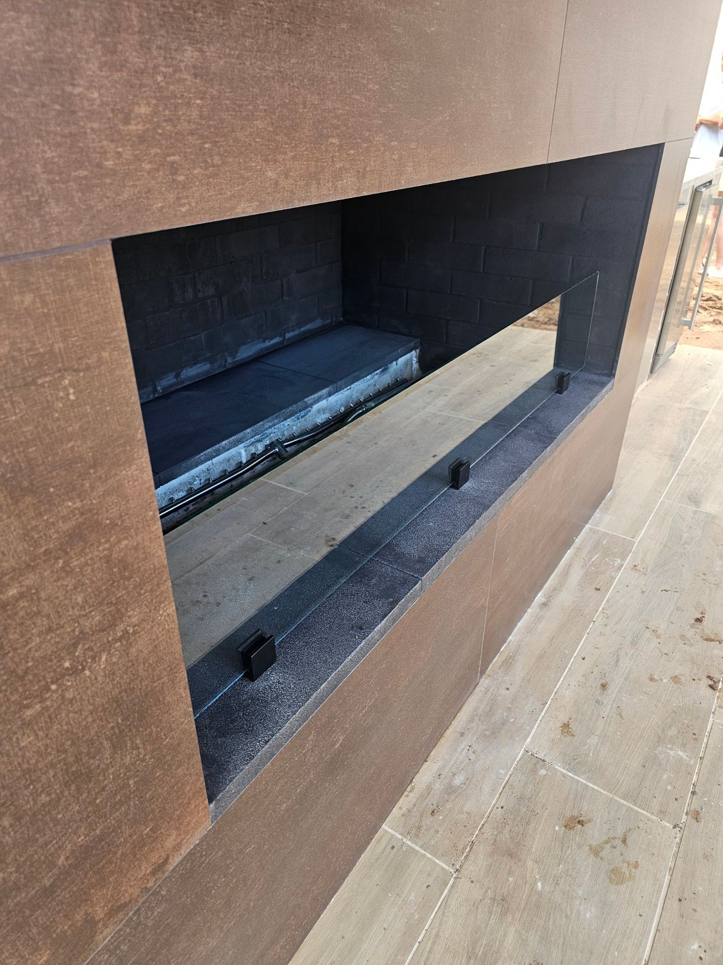 A fireplace is built into the side of a building.