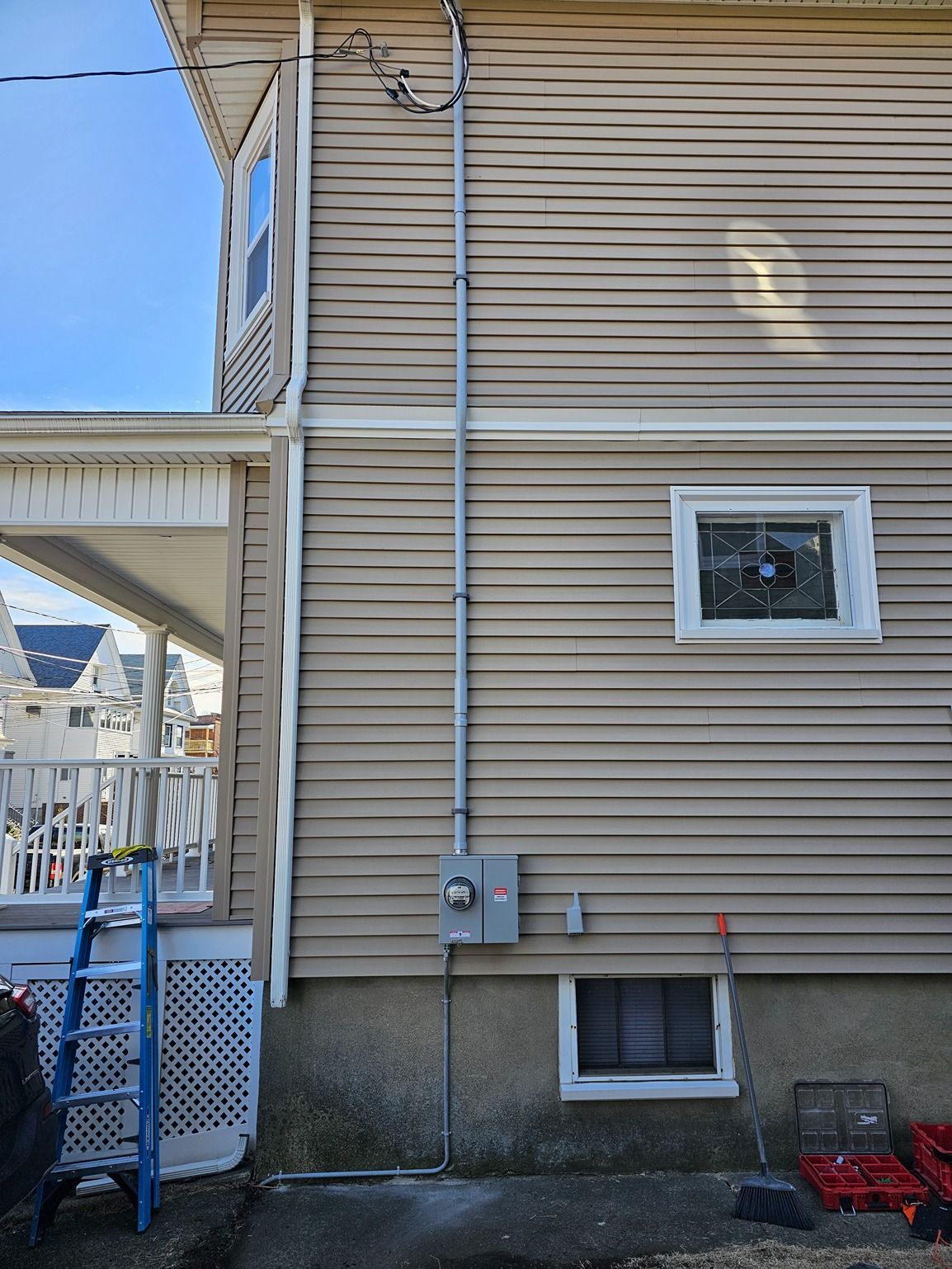 A house with a ladder on the side of it