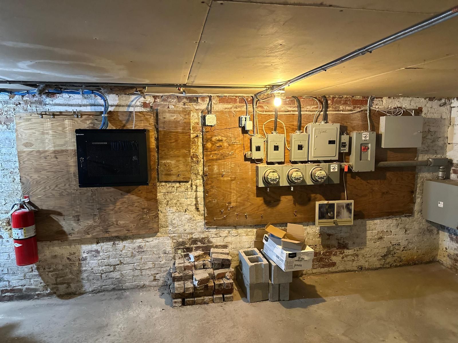 There is a fire extinguisher in the corner of the room.