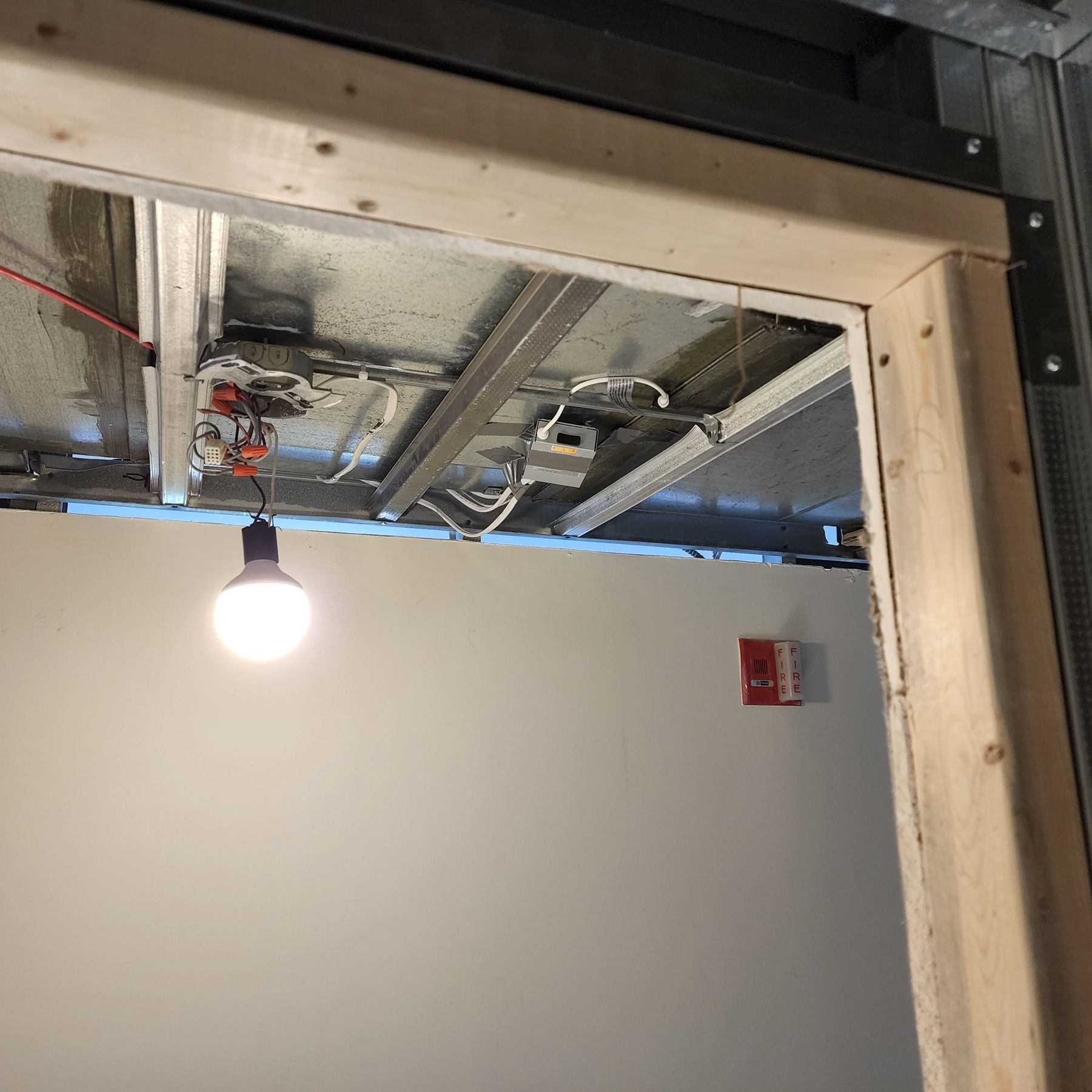 A light bulb is hanging from the ceiling of a room