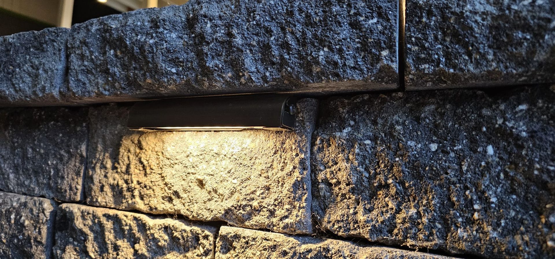 A close up of a electrical box on a wall with the door open