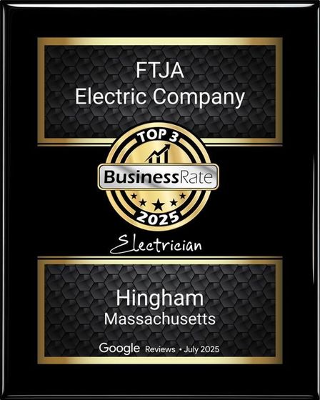 A plaque honoring FTJA Electric Company as a 2025 top 3 electrician in Hingham, Massachusetts based on Google reviews.