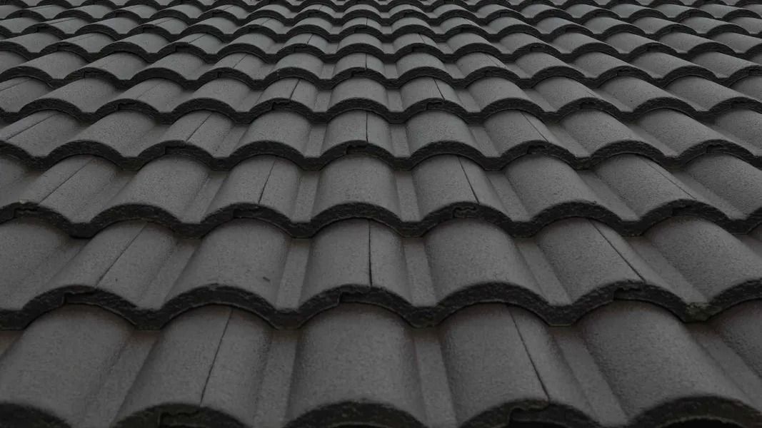 Dark gray tiled roof with repeating curved shingles viewed from above