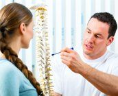Chiropractor explaining to a patient