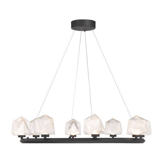 Black chandelier with six white, faceted, gem-like shades, suspended from a ceiling mount.