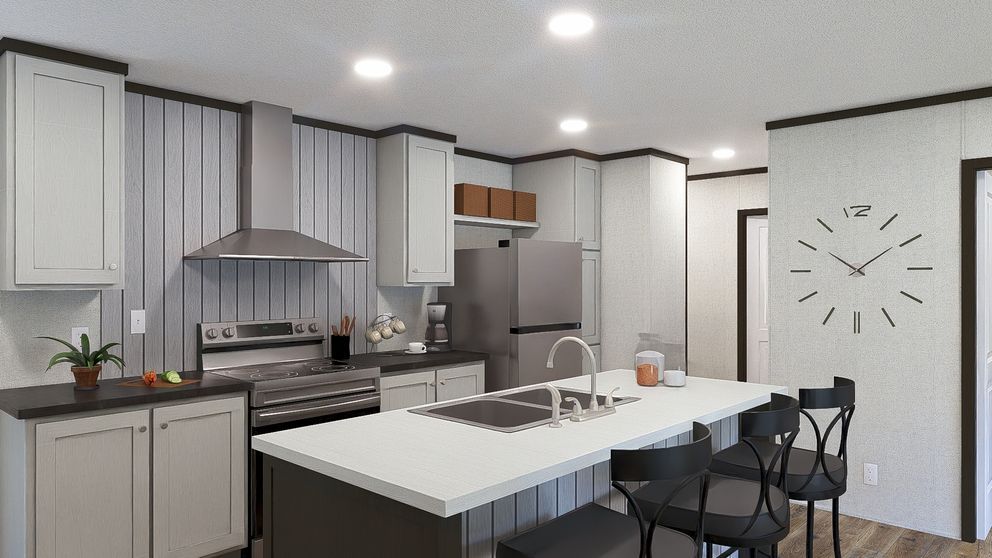 Modern kitchen with white cabinets, stainless appliances, island, bar stools, and a wall clock.