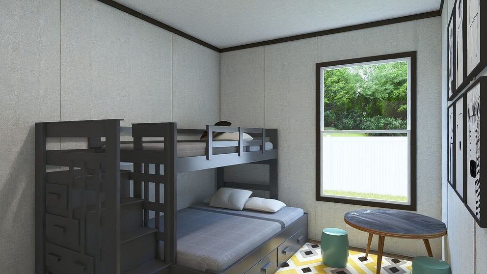 Small bedroom with bunk bed, desk, and large window overlooking greenery