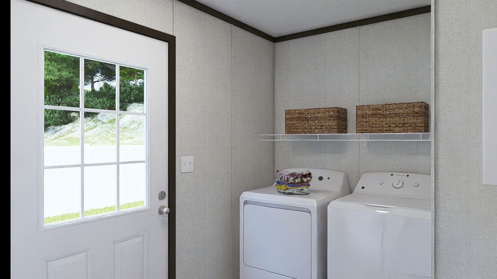 Laundry room with washer and dryer, wall shelf baskets, and a door letting in daylight.