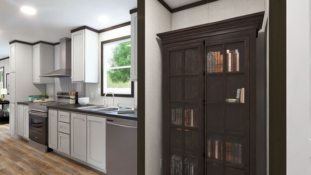 Modern kitchen with gray cabinets, stainless appliances, and a dark wooden cabinet by a window