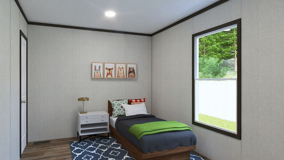 Small bedroom with a bed, nightstand, wall art, and a large window showing greenery.