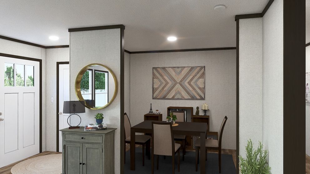 Modern dining nook and entryway with white walls, dark trim, round mirror, and wooden table set for four