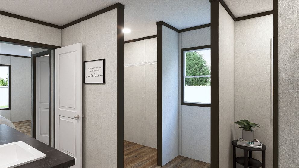 Bright modern interior with gray walls, open doors, a window, and a small plant on a stand.