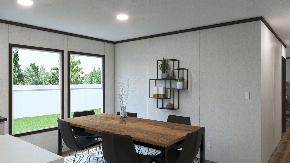 Modern dining room with wooden table, black chairs, sliding glass doors, and wall shelves.