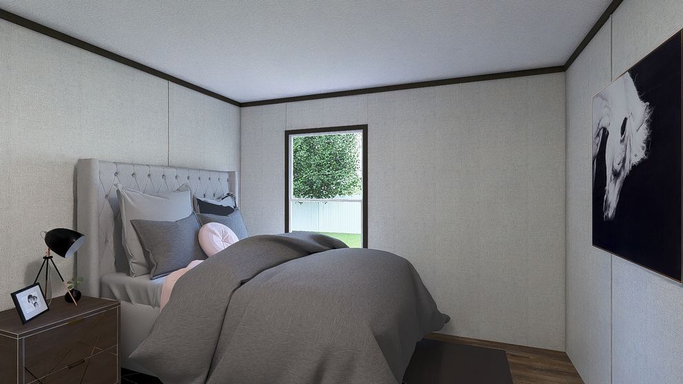 Cozy bedroom with a bed, nightstand, window, and wall art in soft neutral tones