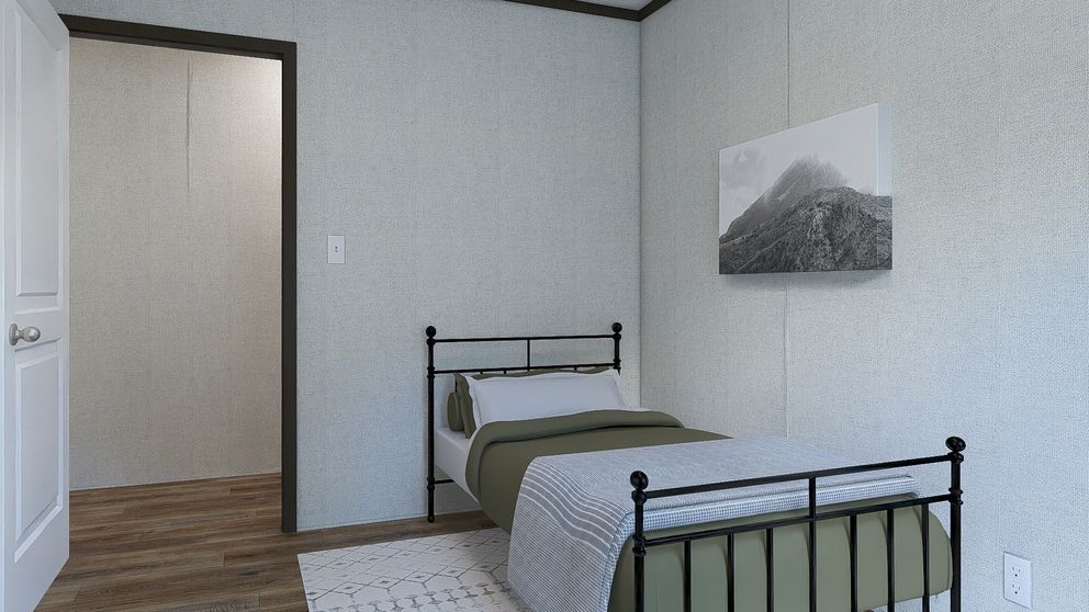 Small bedroom with two single beds, gray walls, wood floor, and a mountain wall print.