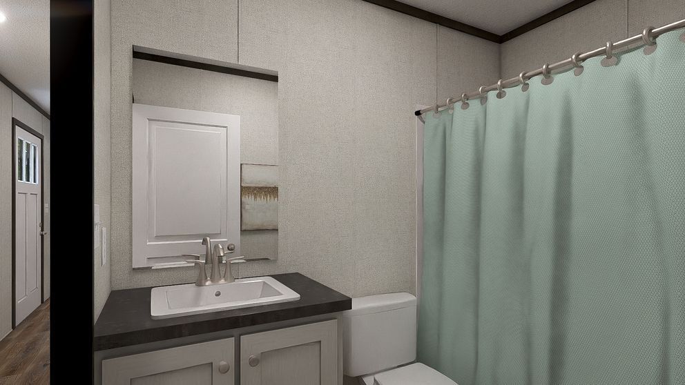 Small bathroom with white sink, mirror, and mint-green shower curtain.