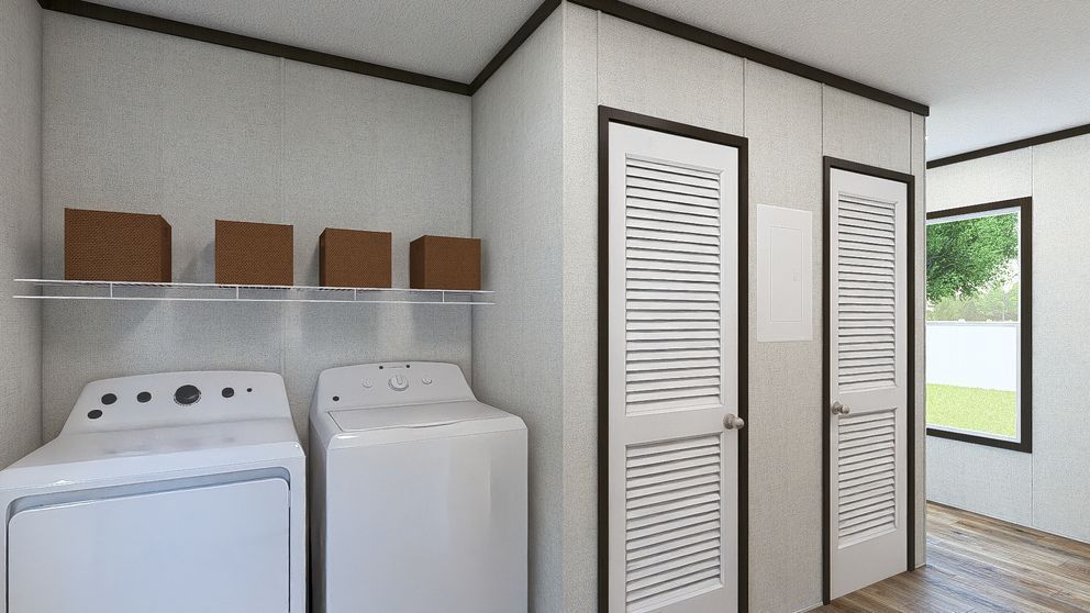 Laundry room with a washer, dryer, storage shelves, and louvered closet doors by a window