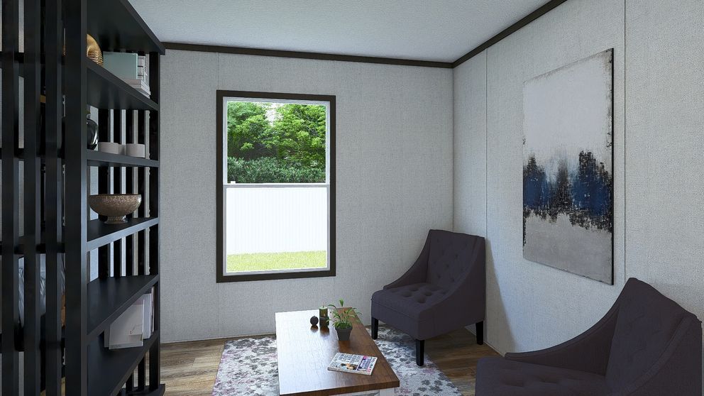 Modern living room with dark chairs, a small table, window, bookshelf, and landscape painting.