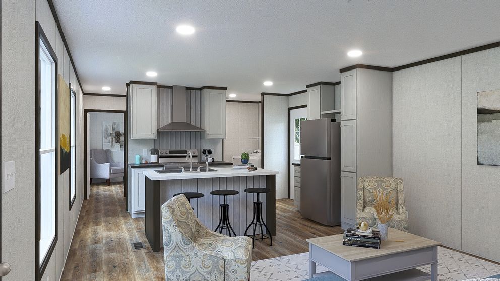 Modern open-plan kitchen and living room with gray cabinets, island, and wood flooring