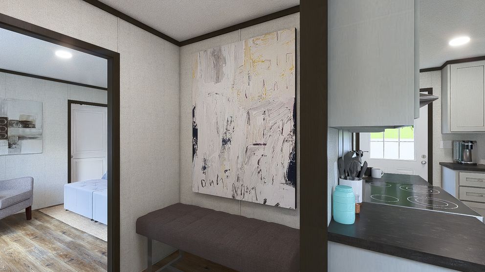 Modern hallway with bedroom view, abstract wall art, dark bench, and kitchen counter with decor.