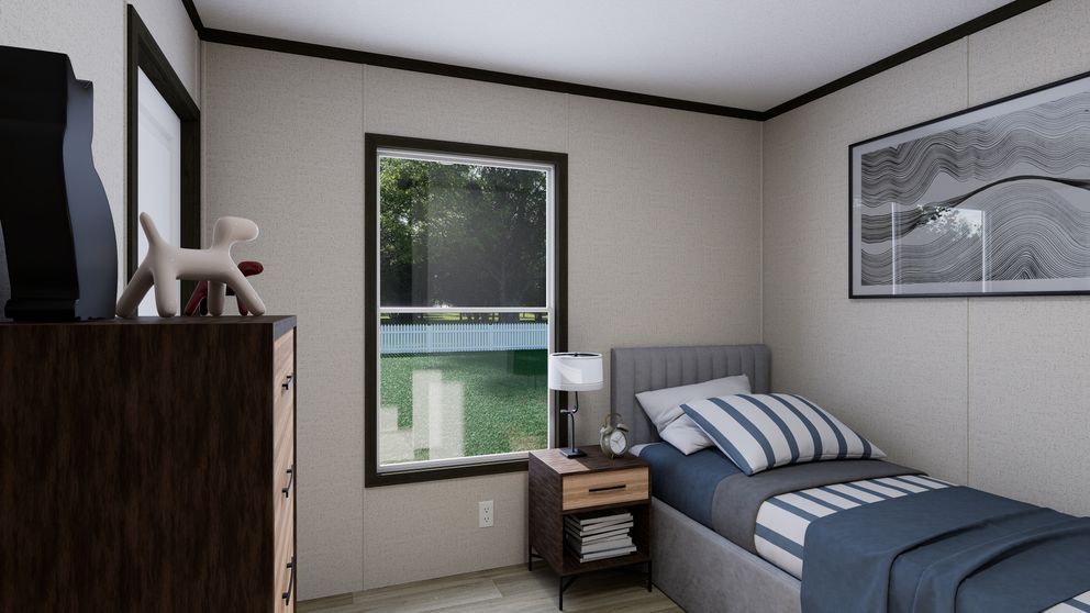 Small bedroom with a bed, window, dresser, and framed wall art in neutral tones.
