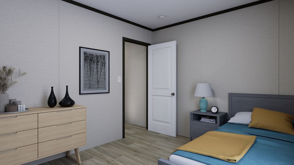 Minimal bedroom with a bed, dresser, nightstand, and white door on light wood flooring.