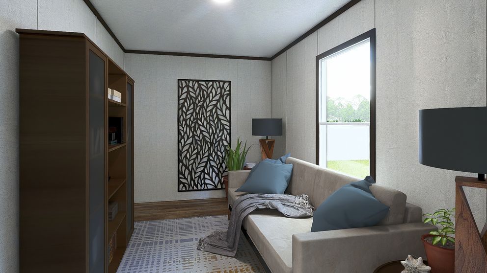 Modern living room with beige sofa, blue pillows, large window, and tall dark bookshelf