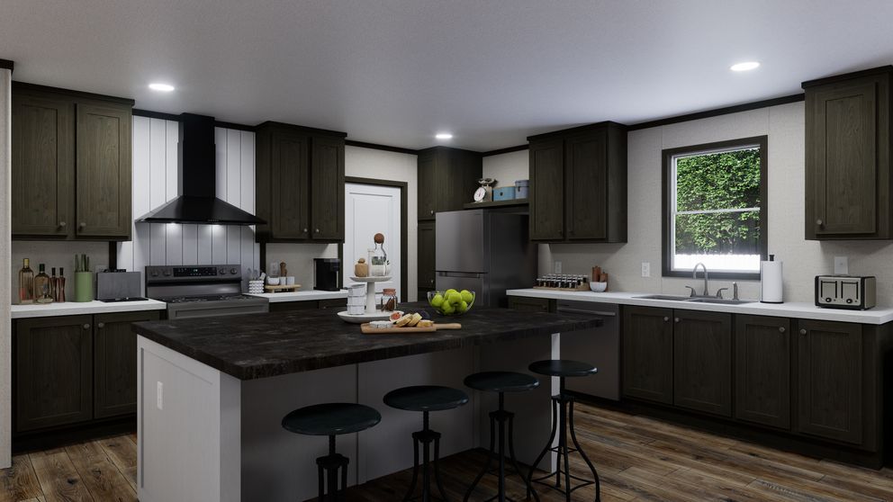 Modern kitchen with dark cabinets, large island, and three black stools under pendant lights