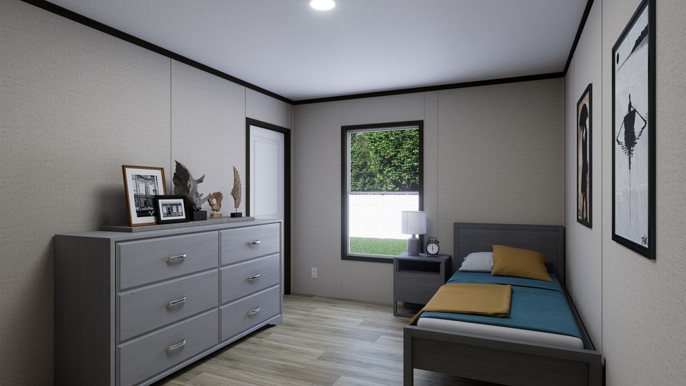 Small bedroom with gray dresser, single bed, window, and framed wall art in soft neutral tones
