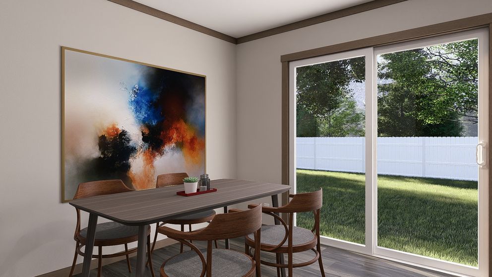 Modern dining area with abstract wall art, table and chairs, and large sliding glass doors overlooking a backyard.