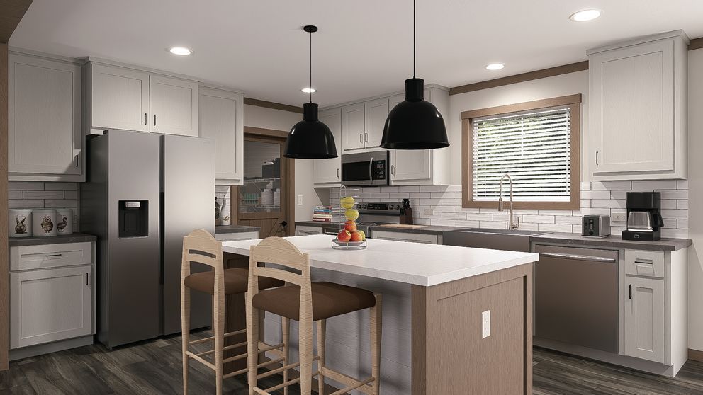 Modern kitchen with gray cabinets, white island, black pendant lights, and two wooden stools