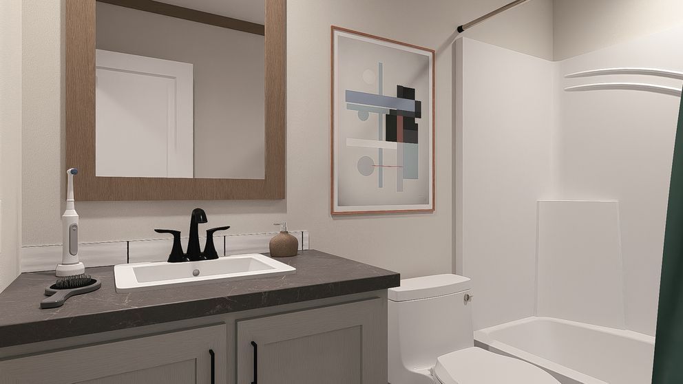 Small bathroom with dark vanity, white sink, toilet, mirror, and shower curtain.