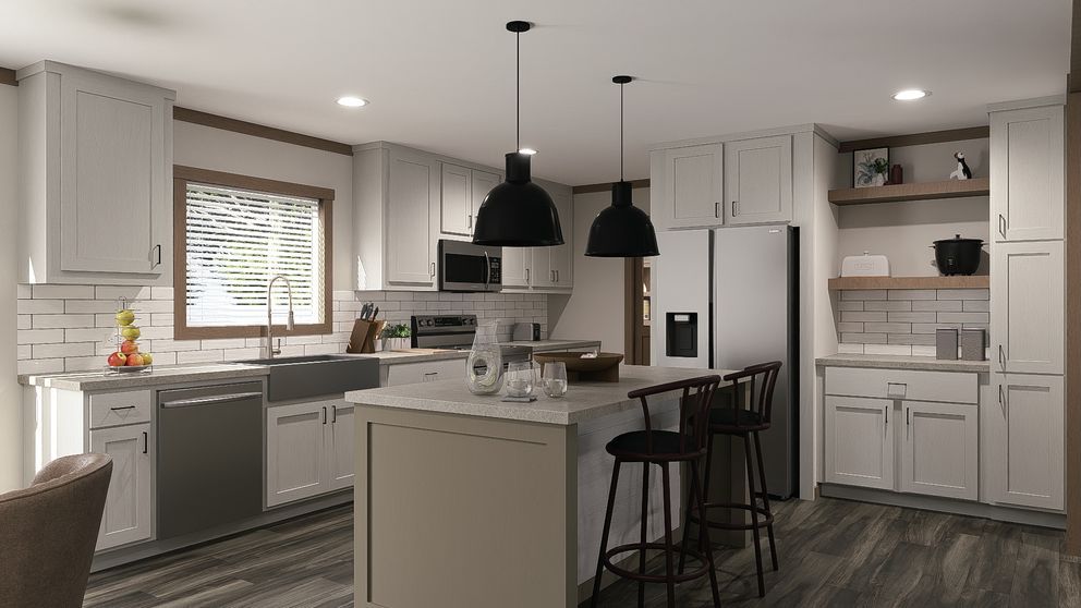 Modern white kitchen with island, black pendant lights, bar stools, and stainless steel appliances.