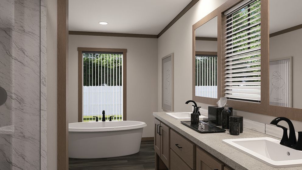 Modern bathroom with double vanity, large mirror, and freestanding tub by a window with blinds